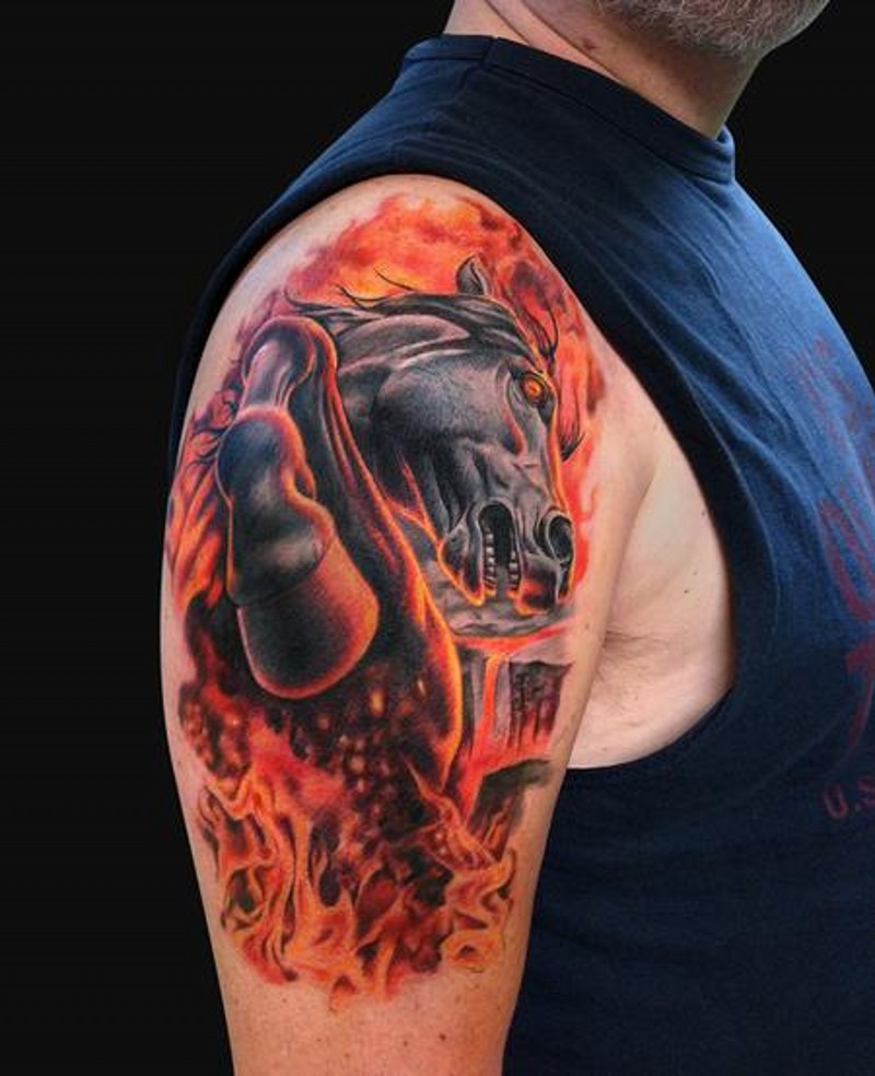 Fabulous colored shoulder tattoo of running horse in flames