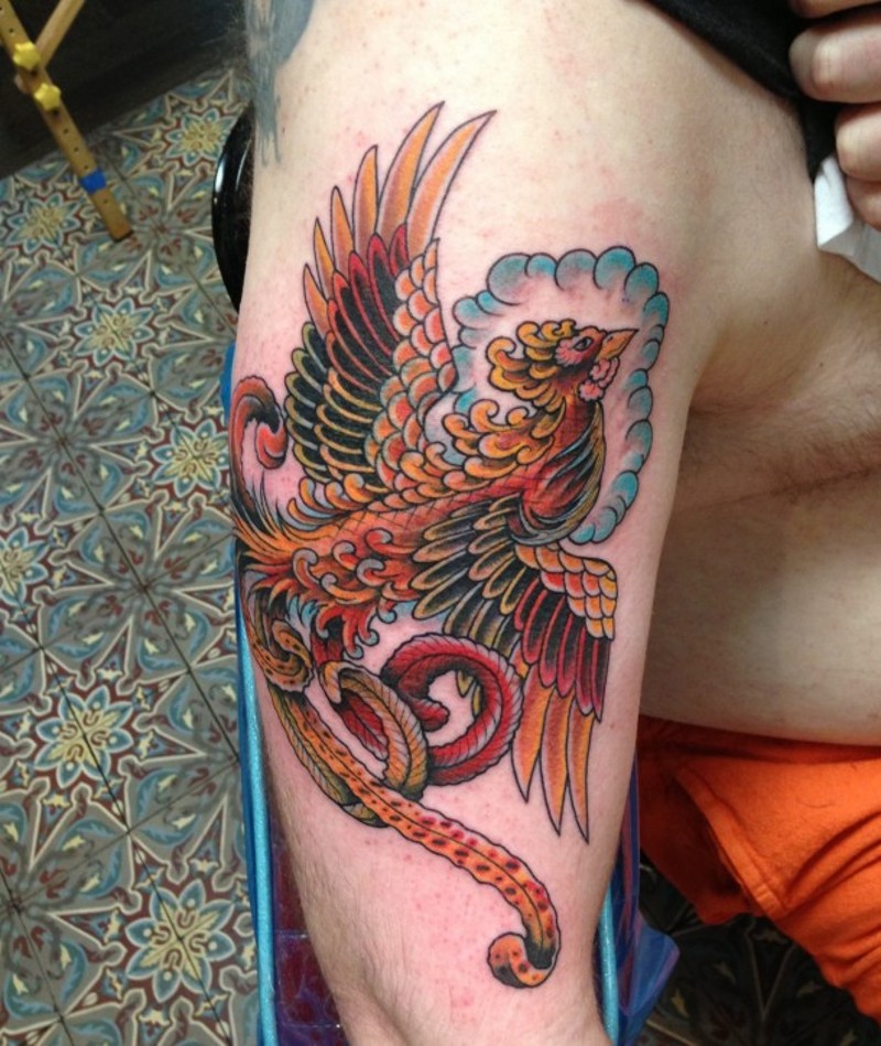 Fairy flying Phoenix bird multicolored shoulder tattoo in old school style