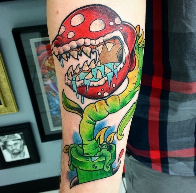Fairy tale Venus flytrap with saliva full jaw bright colored forearm length tattoo