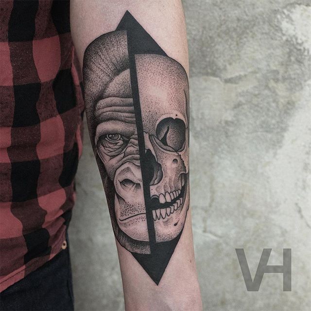 Fantastic designed by Valentin Hirsch split tattoo of human skull and gorilla head