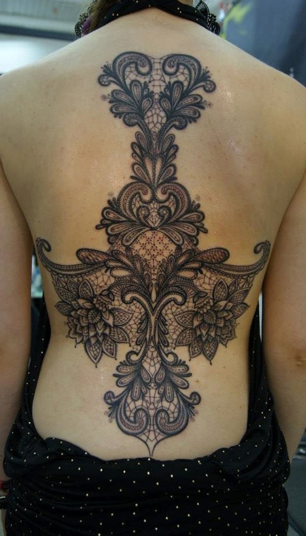 Fantastic designed very detailed floral tattoo on whole back