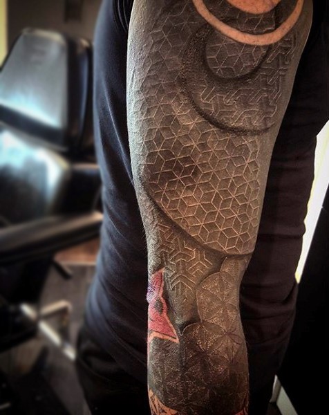 Fantastic designed very realistic looking ornament tattoo on sleeve