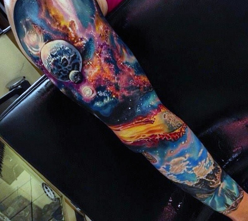 Fantastic detailed and colored space tattoo on sleeve