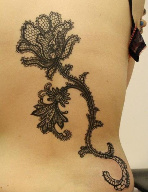 Fantastic painted black ink flower tattoo on whole back