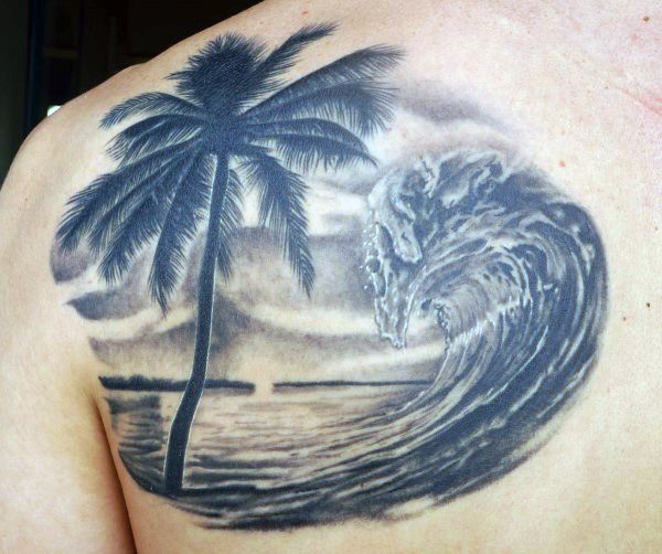 Fantastic painted very beautiful waves with palm tree tattoo on shoulder