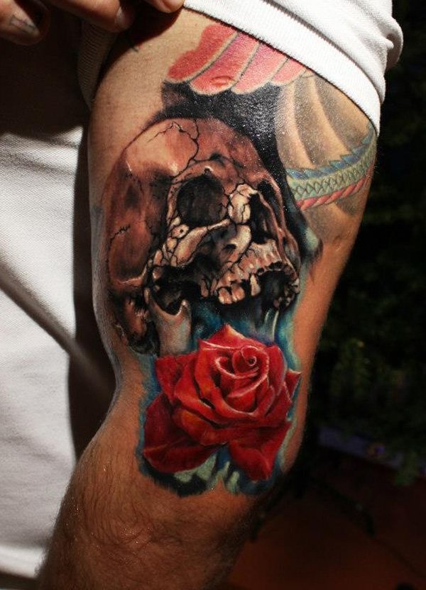Fantastic realism style arm tattoo of human skull with rose flowers