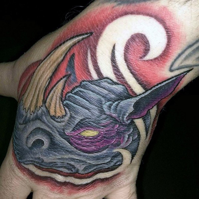 Fantasy cartoon style funny colored demonic rhino tattoo on hand