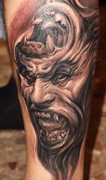 Fantasy illustrative style demonic gorilla tattoo on leg