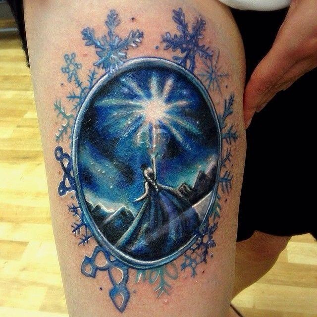 Fantasy looking thigh tattoo of beautiful mirror with magical woman
