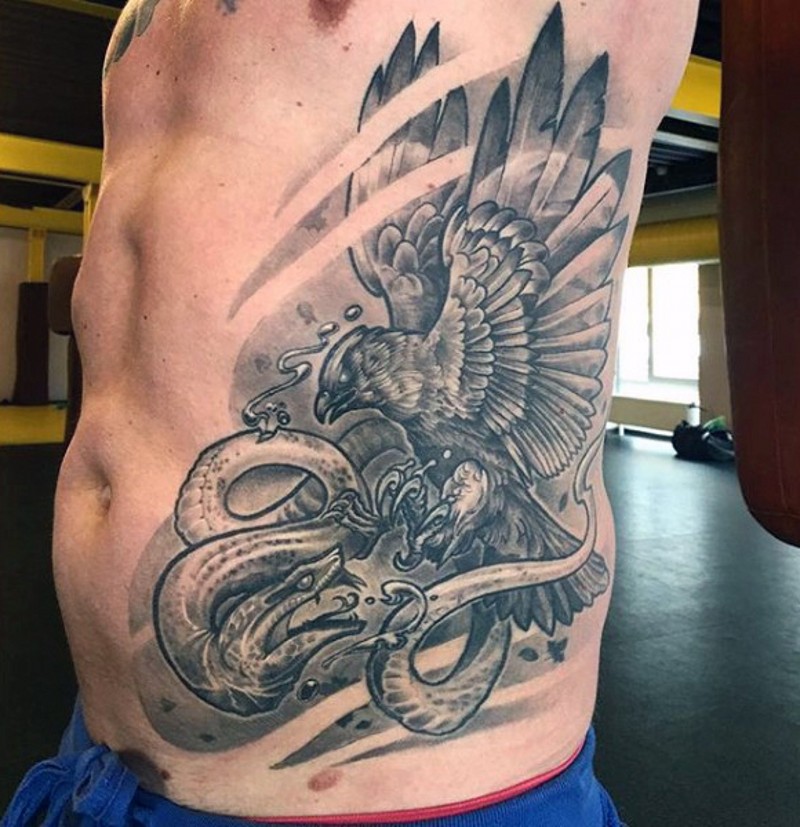 Fantasy style black ink detailed side tattoo of eagle and snake fight