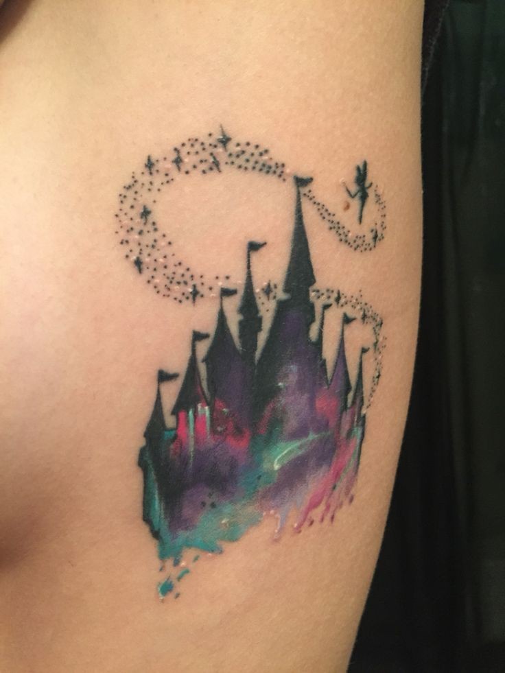 Fantasy style colored Disney castle tattoo with Tinkerbell