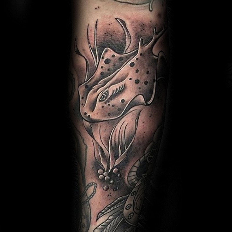 Fantasy style colored forearm tattoo of swimming ray