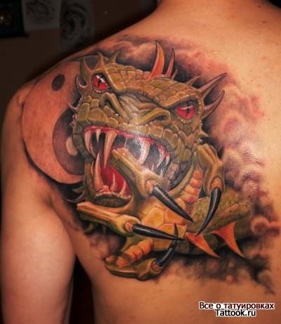 Fantasy style colored scapular tattoo of evil dragon