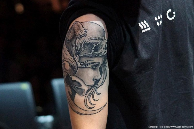 Fantasy style detailed shoulder tattoo of woman face with skull helmet