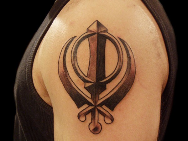 Fantasy style mystical colored emblem tattoo on shoulder
