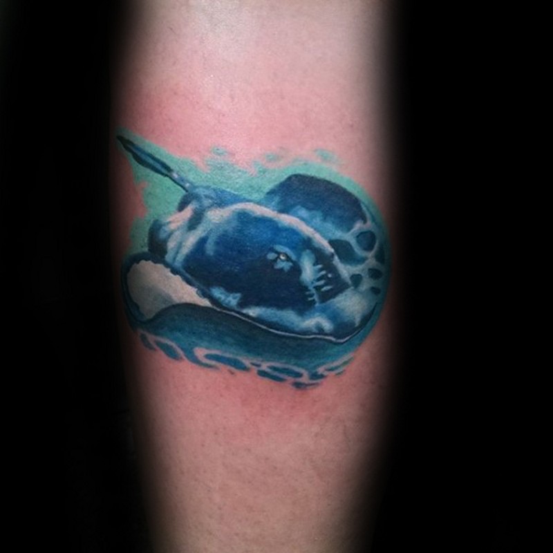 Fantasy style painted and colored forearm tattoo of swimming ray