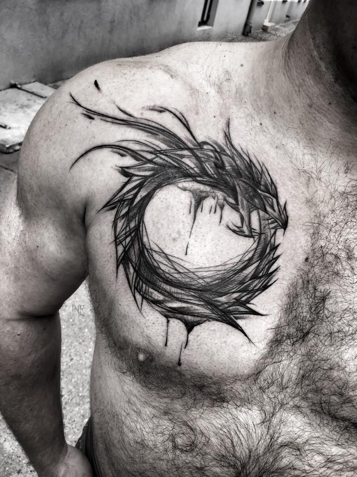Fantasy themed black ink chest tattoo of dragon by Inez Janiak