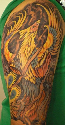 Fire Phoenix rising from ashes tattoo
