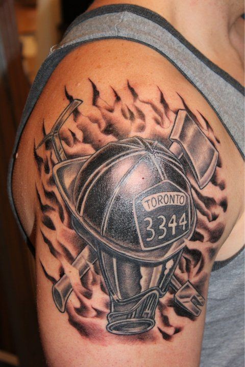 Firefighter memorial black and grays style shoulder tattoo with lettering
