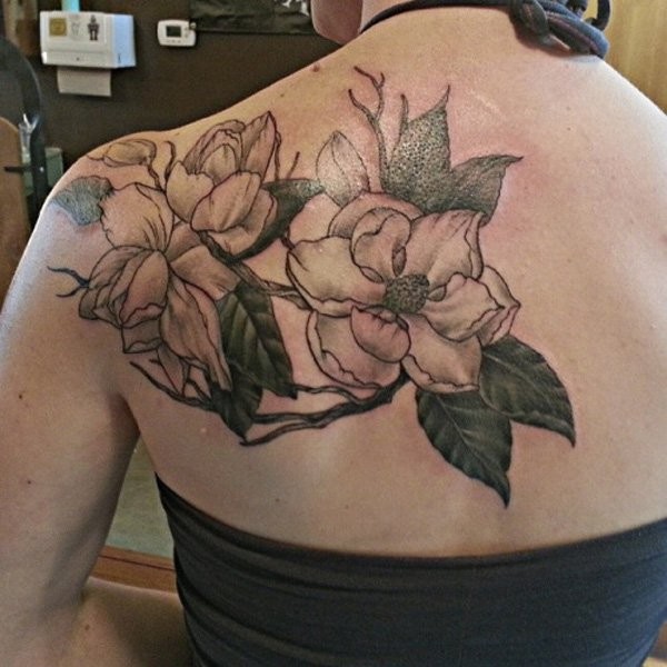 Floral style colored scapular tattoo of cool flowers
