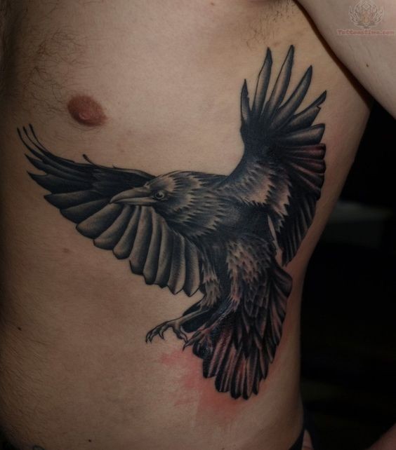 Flying black detailed crow realistic tattoo on side