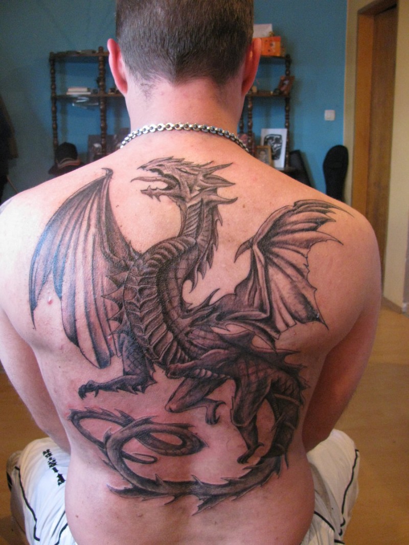 Flying black dragon tattoo for men