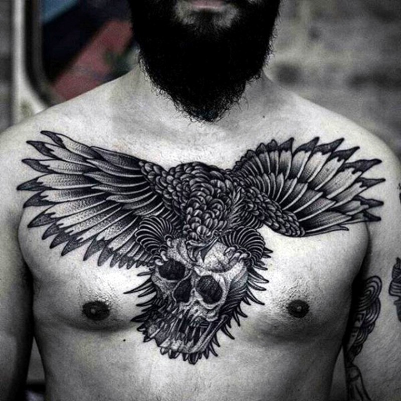 Flying eagle with human skull in clutches black and white detailed chest tattoo