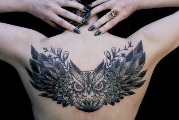 Flying patchwork owl tattoo on back