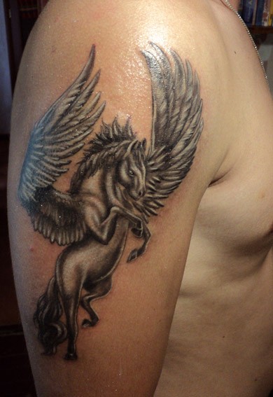 Flying pegasus tattoo on shoulder