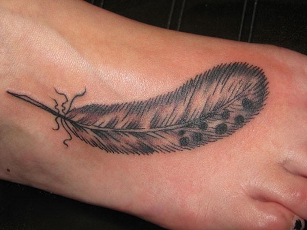 Foot tattoo feather with shadows