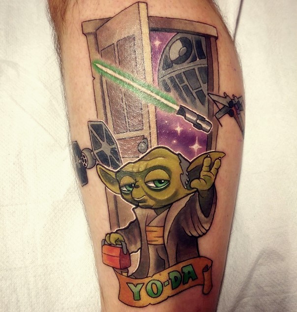 Funny cartoon like awesome leg tattoo of Star Wars Yoda and empire ships