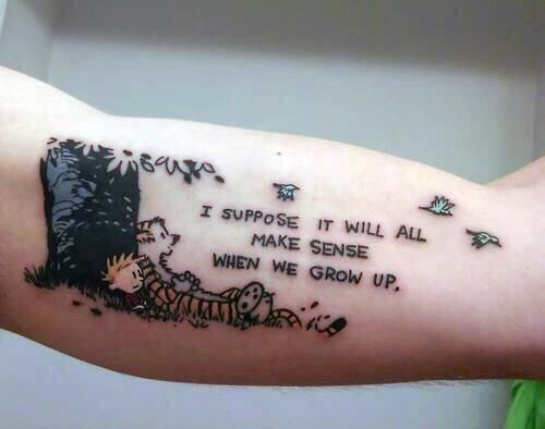 Funny cartoon like boy with tiger and lettering tattoo on arm