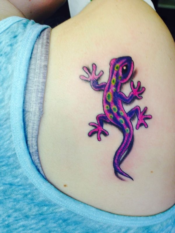 Funny cartoon like bright colored lizard in 3D style tattoo on shoulder blade