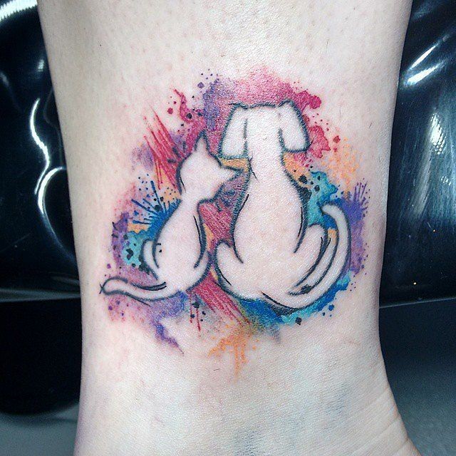 Funny cartoon like colored little dog and cat  tattoo on ankle