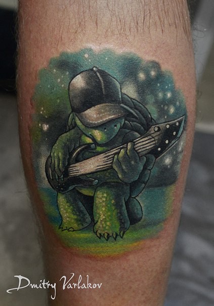 Funny cartoon turtle playing electric guitar colored tattoo on man's calf by Dmitry Varlakov