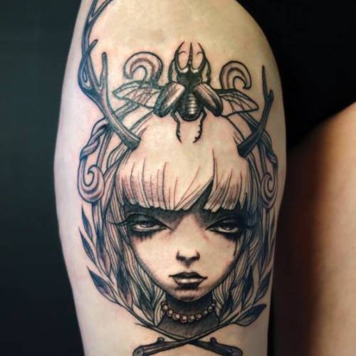 Funny colored thigh tattoo of demonic woman with insect