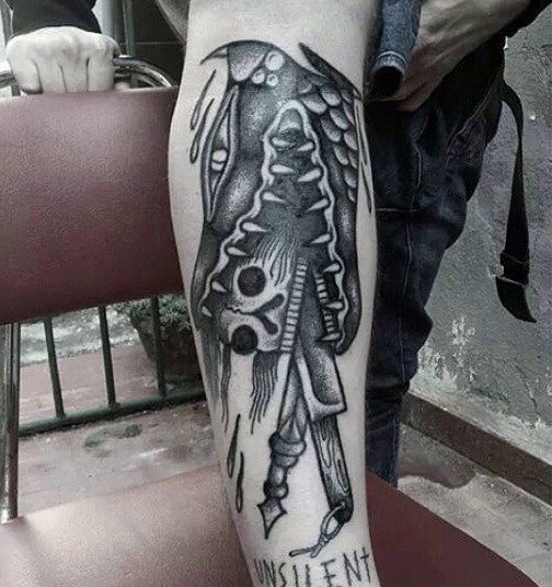 Funny designed and painted black ink alligator with skull and knifes tattoo on leg