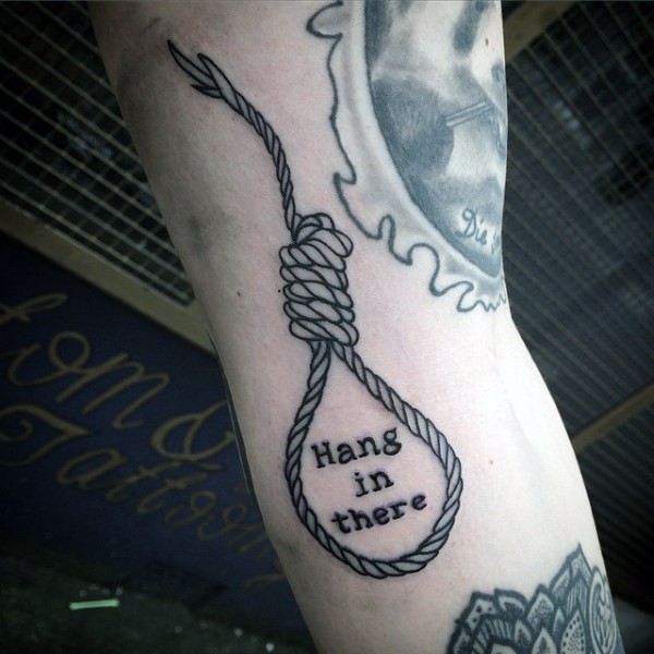 Funny designed black ink rope with lettering tattoo on arm