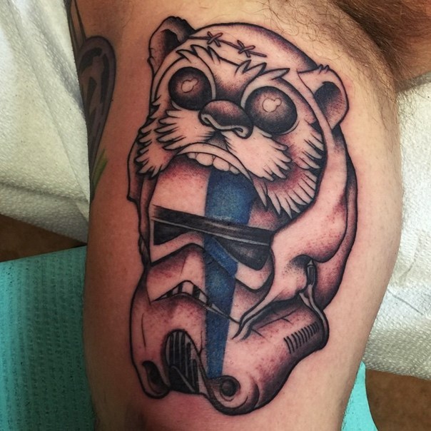 Funny designed colored Storm Troopers helmet with ewok skin tattoo on biceps