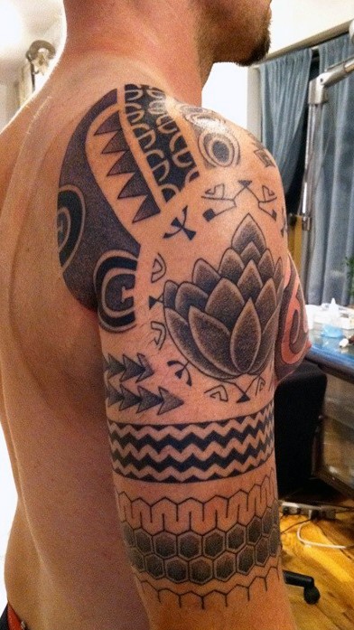 Funny designed tribal style black ink tattoo on half sleeve zone