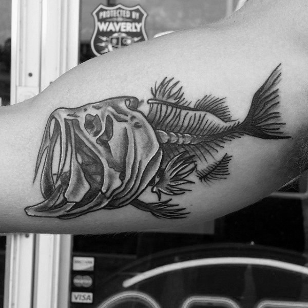 Funny fish skeleton detailed tattoo on biceps