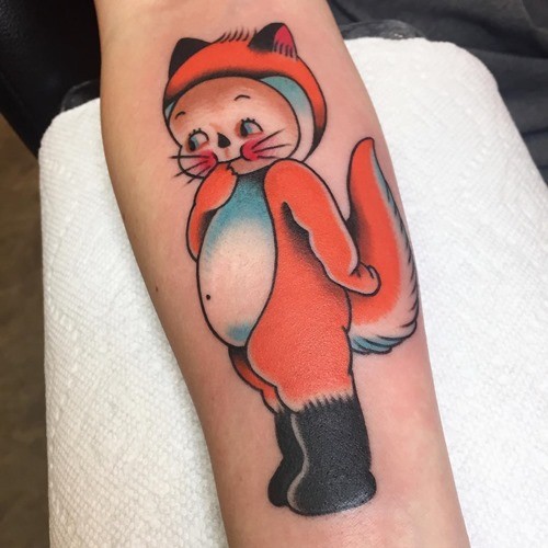 Funny little cartoon like colored human girl-fox tattoo on forearm zone