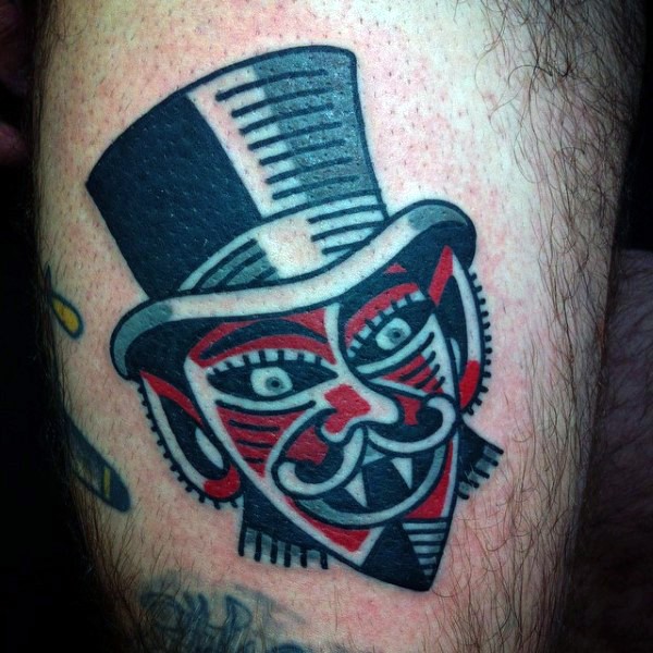 Funny little colored vampire gentleman tattoo on thigh