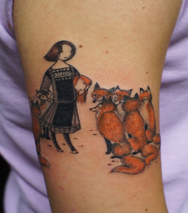 Funny looking colored arm tattoo of woman with foxes