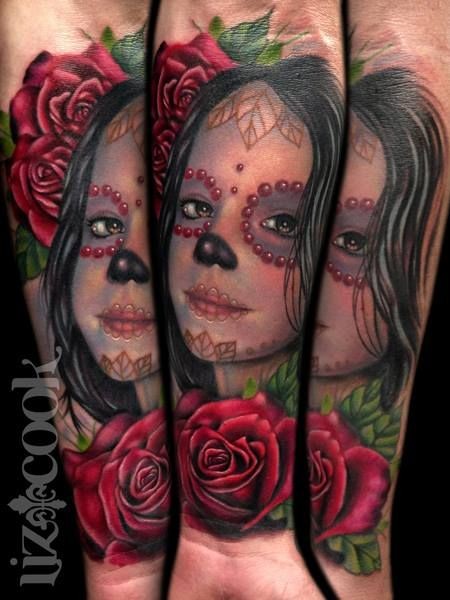 Funny looking colored forearm tattoo of small girl portrait with flowers