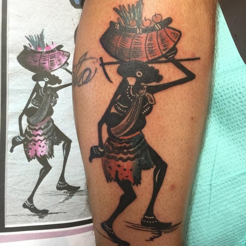 Funny looking colored leg tattoo of tribal worker with basket