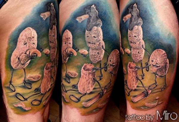 Funny looking colored thigh tattoo of magical peanuts