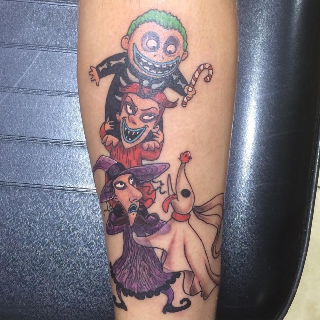 Funny looking colorful forearm tattoo of dog shaped ghost and monsters
