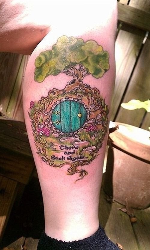 Funny Lord of the Rings themed colorful leg tattoo tattoo of hobbit house with lettering