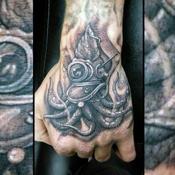 Funny painted little black and white squid in old divers helmet tattoo on hand